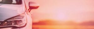 Part of a car with a scenic landscape.