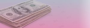 Stack of cash on top of printed calendar